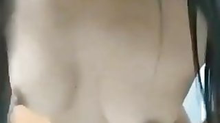 Horny gal finger-banging in bathroom